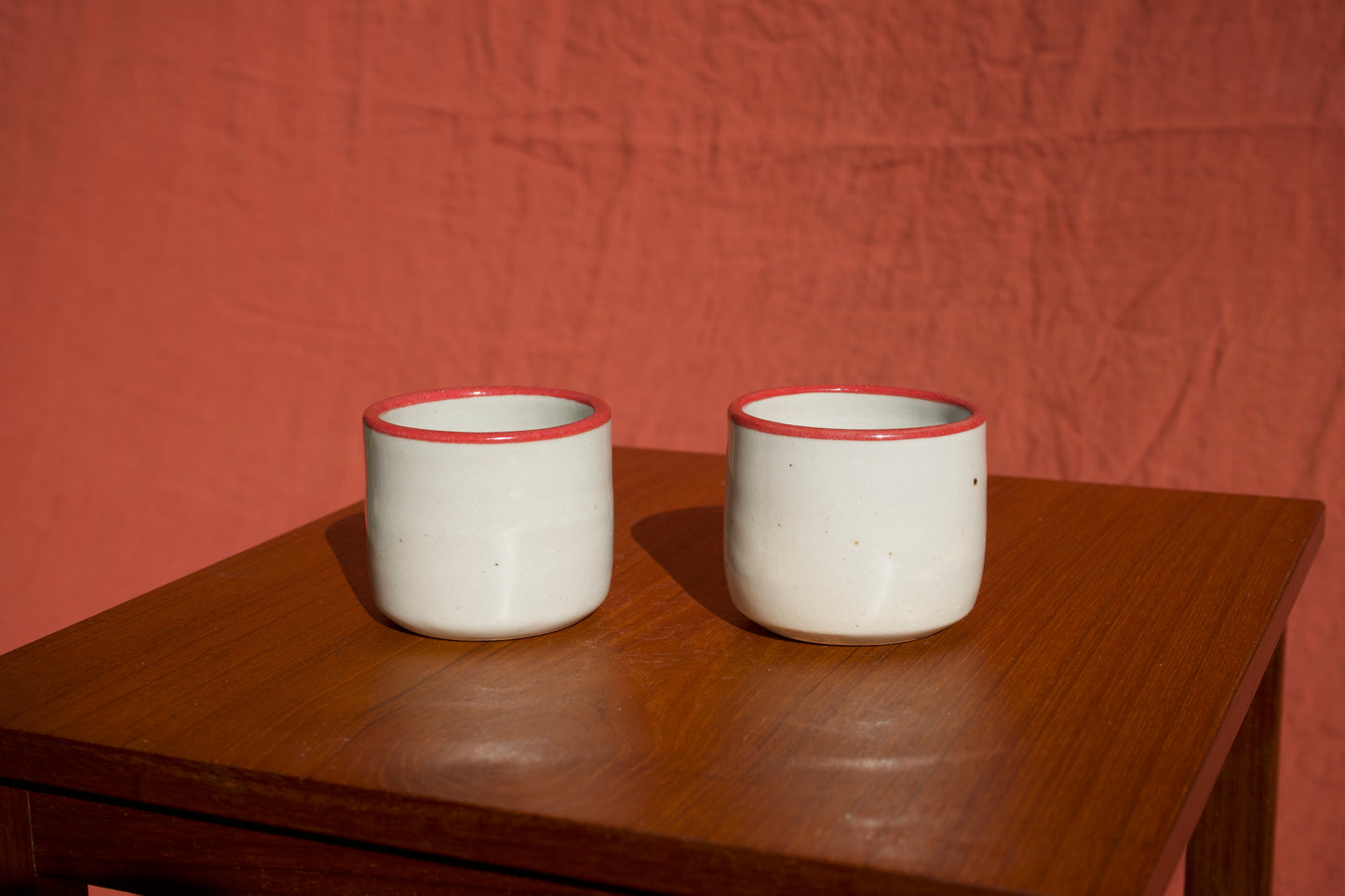 Red Rimmed Cups with Hand - Set of Two